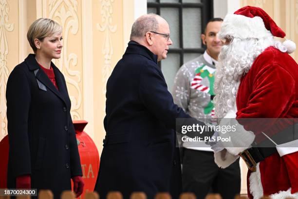 Prince Albert II of Monaco and Princess Charlene of Monaco attend the Christmas Tree at Monaco Palace on December 20, 2023 in Monaco, Monaco.