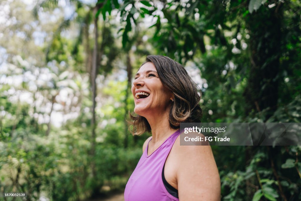 Mature woman looking around on the public park