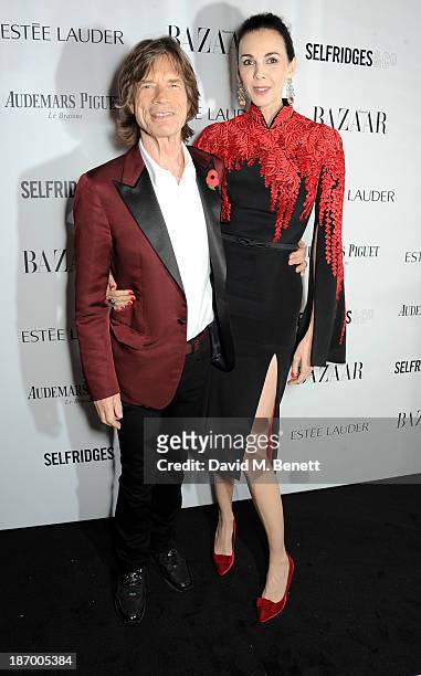 Mick Jagger and L'Wren Scott arrive at the Harper's Bazaar Women of the Year awards at Claridge's Hotel on November 5, 2013 in London, England.