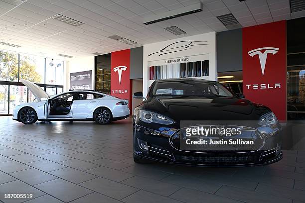 Two Tesla Model S cars are displayed at a Tesla showroom on November 5, 2013 in Palo Alto, California. Tesla will report third quarter earnings today...