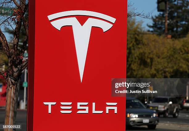 Sign is posted at a Tesla showroom on November 5, 2013 in Palo Alto, California. Tesla will report third quarter earnings today after the closing...