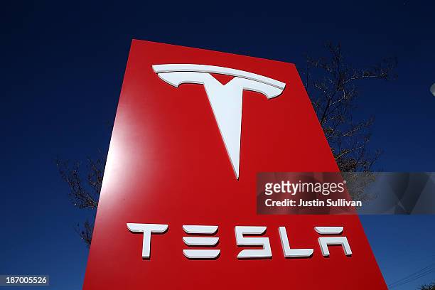 Sign is posted at a Tesla showroom on November 5, 2013 in Palo Alto, California. Tesla will report third quarter earnings today after the closing...