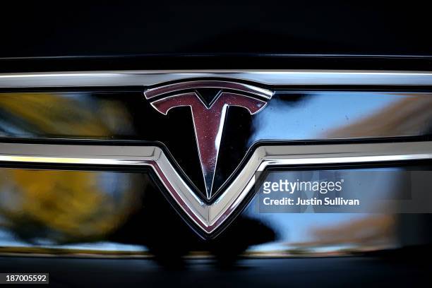 The Tesla logo is shown on the front of a new Tesla Model S car at a Tesla showroom on November 5, 2013 in Palo Alto, California. Tesla will report...