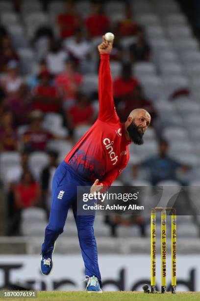 Moeen Ali of England bowls during the 4th T20 International match between West Indies and England at Brian Lara Cricket Academy on December 19, 2023...