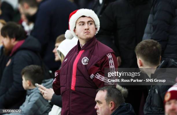 Hearts fan wears a Santa hat during a cinch Premiership match between Heart of Midlothian and St Mirren at Tynecastle Park, on December 23 in...