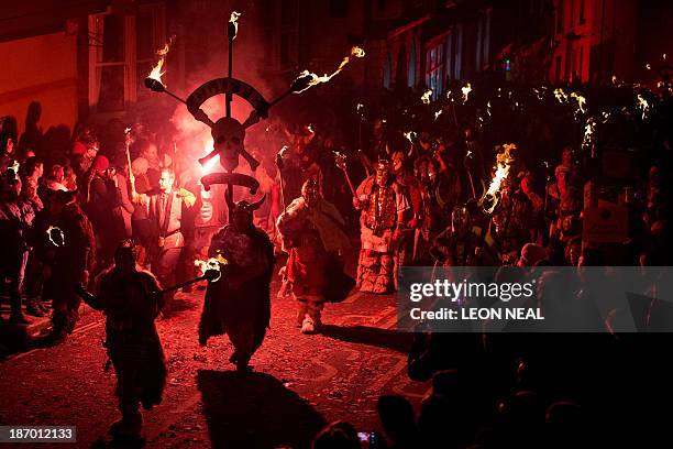 Bonfire societies parade through the streets during the Bonfire Night celebrations on November 5, 2013 in Lewes, Sussex in England. Bonfire Night is...