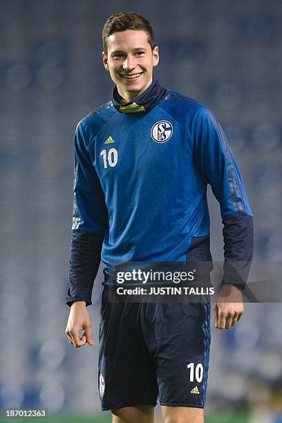 Schalke's German midfielder Julian Draxler looks on during a training session at Stamford Bridge in London on October 5, 2013 a day ahead of their...