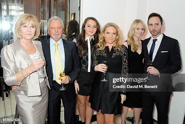 Jackie Adams, Tony Adams, Liberty Adams, Louise Adams, guest and Christian Adams arrive at the Harper's Bazaar Women of the Year awards at Claridge's...