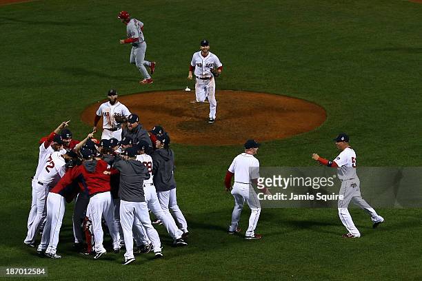 The Boston Red Sox celebrate after defeating the St. Louis Cardinals in Game Six of the 2013 World Series at Fenway Park on October 30, 2013 in...
