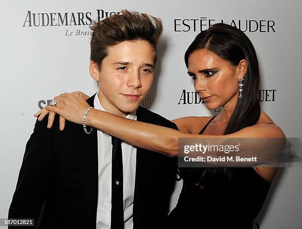 Brooklyn Beckham and Victoria Beckham arrive at the Harper's Bazaar Women of the Year awards at Claridge's Hotel on November 5, 2013 in London,...