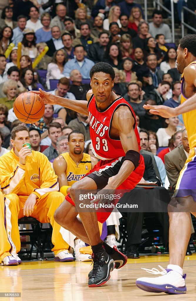 Scottie Pippen of the Portland Trail Blazers is defended by Robert ...