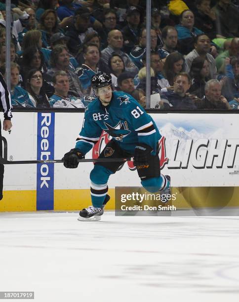 Tyler Kennedy of the San Jose Sharks skates after the puck against the Calgary Flames during an NHL game on October 19, 2013 at SAP Center in San...