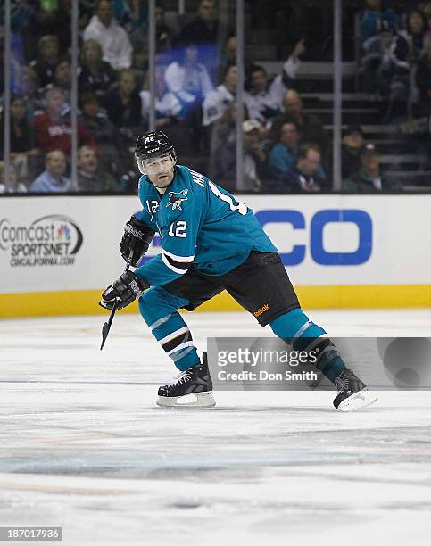 Patrick Marleau of the San Jose Sharks skates after the puck against the Calgary Flames during an NHL game on October 19, 2013 at SAP Center in San...