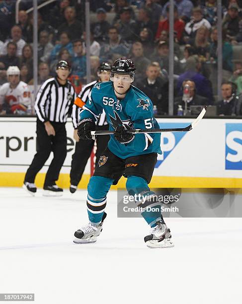 Matt Irwin of the San Jose Sharks skates after the puck against the Calgary Flames during an NHL game on October 19, 2013 at SAP Center in San Jose,...