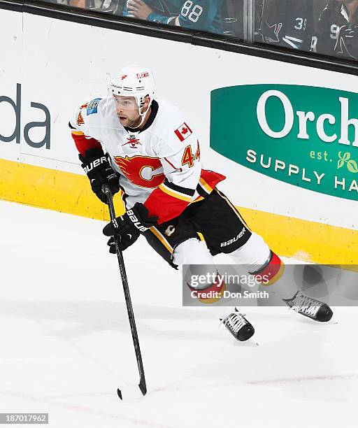 Kris Russell of the Calgary Flames skates after the puck against the San Jose Sharks during an NHL game on October 19, 2013 at SAP Center in San...