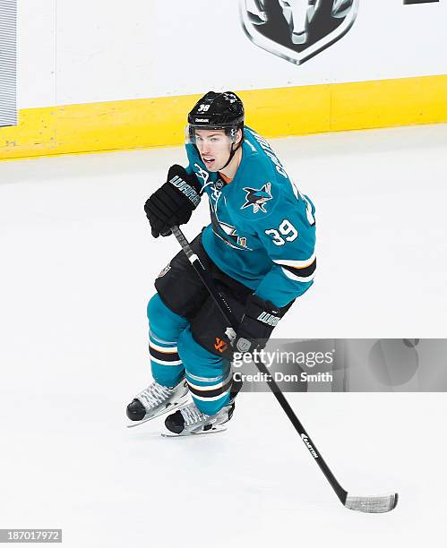 Logan Couture of the San Jose Sharks skates after the puck against the Calgary Flames during an NHL game on October 19, 2013 at SAP Center in San...