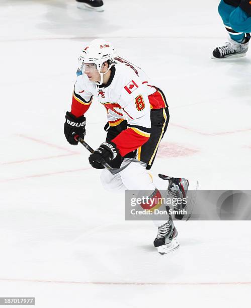 Joe Colborne of the Calgary Flames skates after the puck against the San Jose Sharks during an NHL game on October 19, 2013 at SAP Center in San...