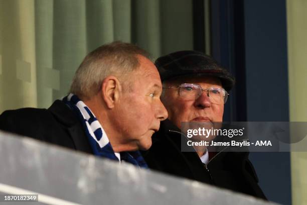 Barry Fry director of football at Peterborough United watches the game with Sir Alex Ferguson during the Sky Bet League One match between Shrewsbury...