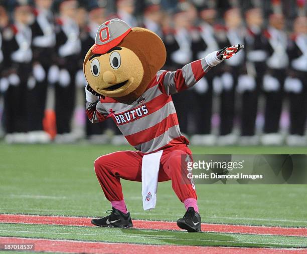 Mascot Brutus the Buckeye dances on the field before a game between the Ohio State Buckeyes and the Penn State Nittany Lions at Ohio Stadium in...