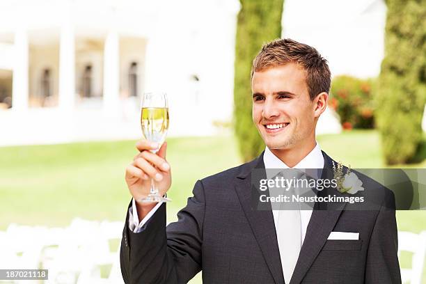 best man champagne flute at garden wedding - best man stock pictures, royalty-free photos & images