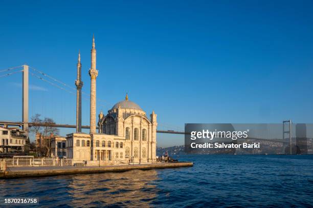 the bosphorus,the bosphorus bridge, the ortakoy mosque istanbul - bosporus stock-fotos und bilder