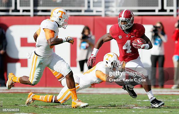 Yeldon of the Alabama Crimson Tide against Cameron Sutton and LaDarrell McNeil of the Tennessee Volunteers at Bryant-Denny Stadium on October 26,...