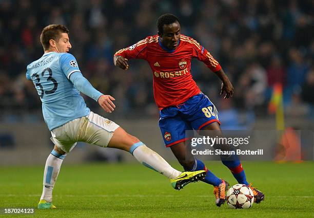 Seydou Doumbia of CSKA is challenged by Matija Nastasic of Manchester City during the UEFA Champions League Group D match between Manchester City and...