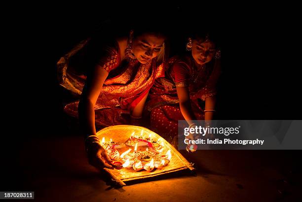 light up at diwali - diwali family stock-fotos und bilder