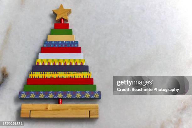 wooden christmas tree decoration on marble table - yule marble stock pictures, royalty-free photos & images