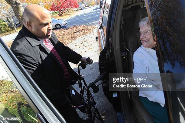 Ninety-two year old Elizabeth Fallisi of Lawrence gets a lift to the polling station from mayoral candidate Daniel Rivera on Tuesday morning....