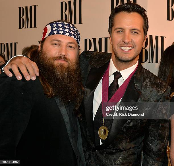 Willie Robertson of Duck Dynasty and country singer Luke Bryan attend the 61st annual BMI Country awards on November 5, 2013 in Nashville, Tennessee.