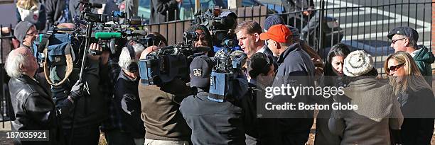 Surrounded by the media, Rep. Marty Walsh voted with his partner Lorrie Higgins and her daughter Lauren Campbell at the Cristo Rey School, 100 Savin...