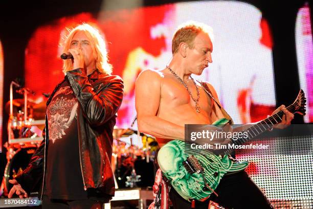 Joe Elliott and Phil Collen of Def Leppard performs at Sleep Train Amphitheatre on September 3, 2009 in Wheatland, California.