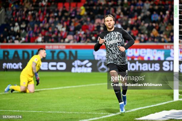 Lucas Hoeler of Sport-Club Freiburg celebrates after scoring their team's first goal during the Bundesliga match between 1. FC Heidenheim 1846 and...