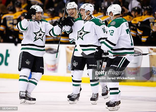 Rich Peverly of the Dallas Stars is congratulated by teammates following his game-winning shootout goal against the Boston Bruins at TD Garden on...