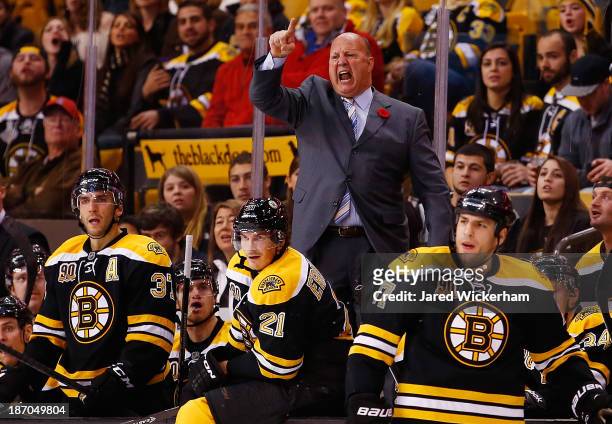 Head coach Claude Julien of the Boston Bruins yells at the referrees following a call in the third period against the Dallas Stars at TD Garden on...