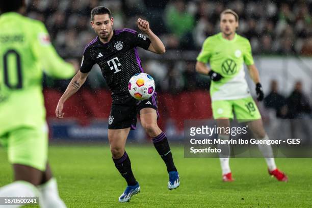 Raphael Guerreiro of Munich controls the ball during the Bundesliga match between VfL Wolfsburg and FC Bayern München at Volkswagen Arena on December...