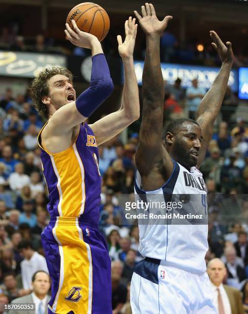 Pau Gasol of the Los Angeles Lakers takes a shot against DeJuan Blair of the Dallas Mavericks at American Airlines Center on November 5, 2013 in...