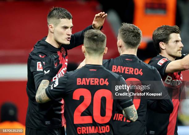 Patrik Schick of Bayer Leverkusen celebrates with teammates after scoring their team's first goal during the Bundesliga match between Bayer 04...