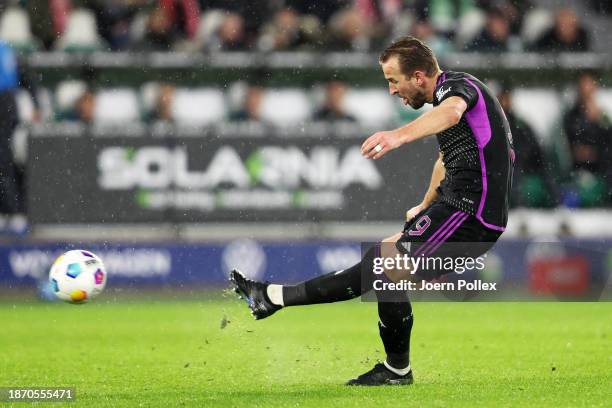 Harry Kane of Bayern Munich scores their team's second goal during the Bundesliga match between VfL Wolfsburg and FC Bayern München at Volkswagen...