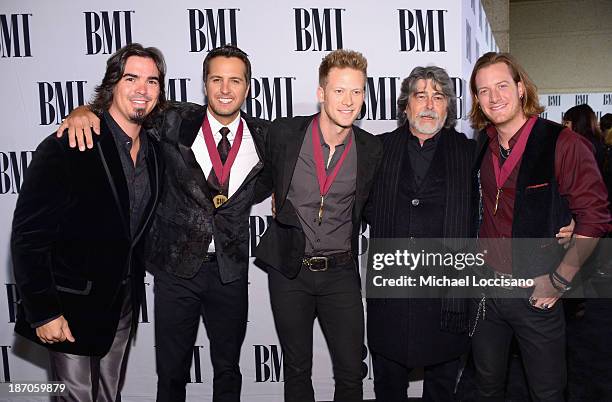 Luke Bryan, Brian Kelly, Randy Owen and Tyler Hubbard attend the 61st annual BMI Country awards on November 5, 2013 in Nashville, Tennessee.