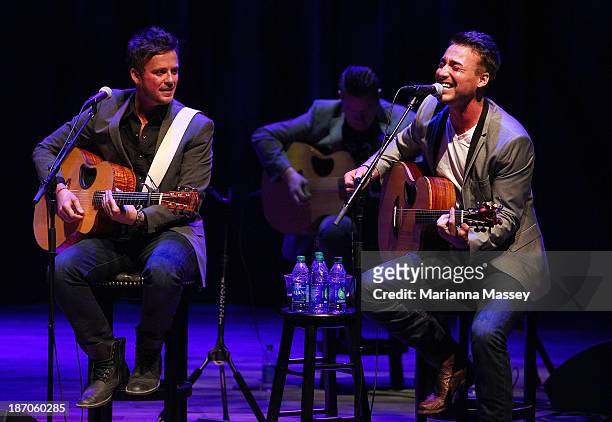 Stephen Barker Liles and Eric Gunderson of Love & Theft perform during the 2013 CMA Songwriters Series at the CMA Theater on November 5, 2013 in...