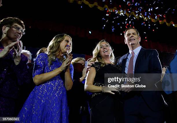 Right to left: Marty Walsh celebrates with his longtime partner Lorrie Higgins, her daughter, Lauren, and his mother, Mary, at his Election Night...