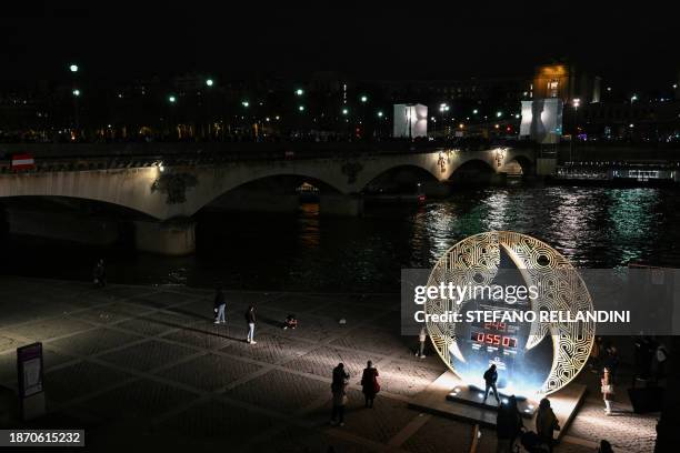 This photograph taken on December 23 shows a view of the Paris 2024 Paralympic Games countdown , 246 days to the event, with the Iena bridge in the...