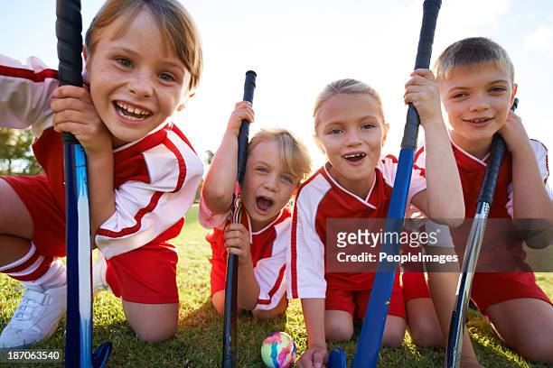 they've got strong team spirit! - kids athletics stock pictures, royalty-free photos & images