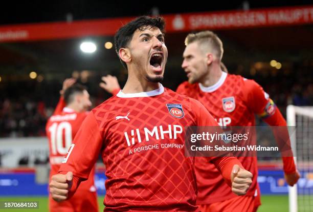 Kevin Sessa of 1.FC Heidenheim celebrates after their team's third goal, an own goal scored by Matthias Ginter of Sport-Club Freiburg during the...