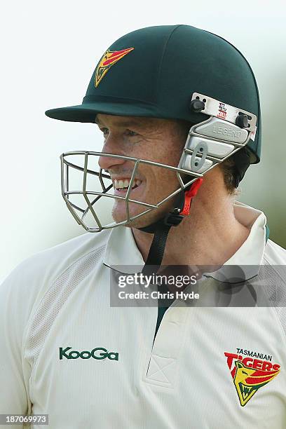 George Bailey of the Tigers looks on during day one of the Sheffield Shield match between the Queensland Bulls and the Tasmania Tigers at Allan...