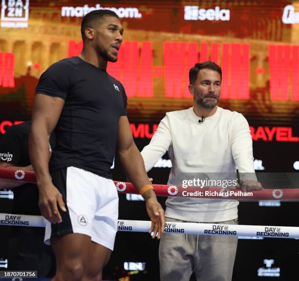 Anthony Joshua with his promoter Eddie Hearn during at 'Day of Reckoning' Media Workout at the Press Arena on December 20, 2023 in Riyadh, Saudi...
