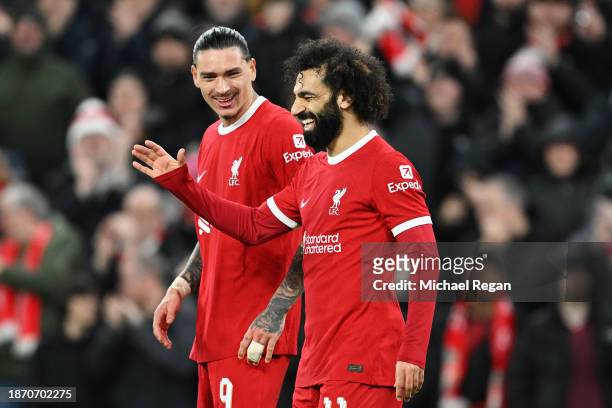 Mohamed Salah of Liverpool celebrates with teammate Darwin Nunez after scoring their team's fourth goal during the Carabao Cup Quarter Final match...