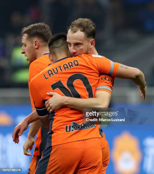 Carlos Augusto of FC Internazionale celebrates with teammate Lautaro Martinez after scoring their team's first goal during the Coppa Italia Round of...